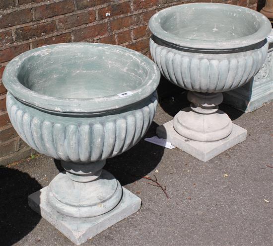 Pair large stone fruited urns on bases